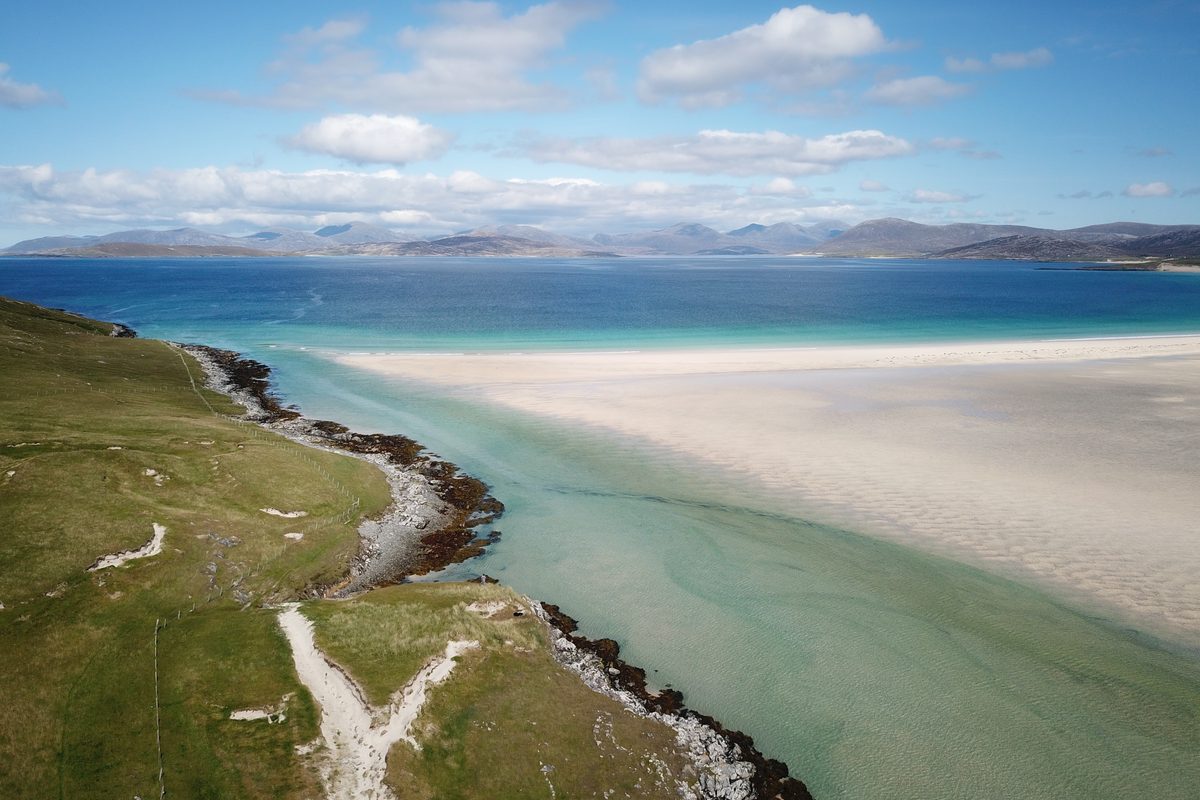 Aerial view of white sand and turquoise water at Scarista beach, Isle of Harris